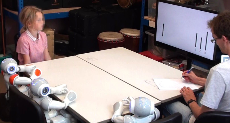 One of 43 children going through the test, with a humanoid robotic peer group.